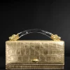 Lioness Top Handle Clutch- Gold